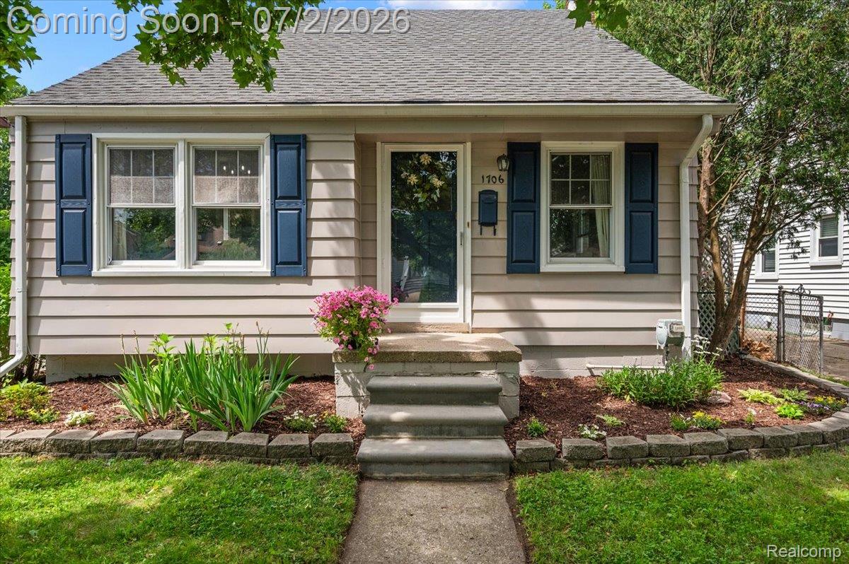 1706 Princeton Road Berkley, MI 48072 - Photo 2 of 49 Charming single-story residence with neutral siding, a grey shingle roof, and contrasting blue window shutters