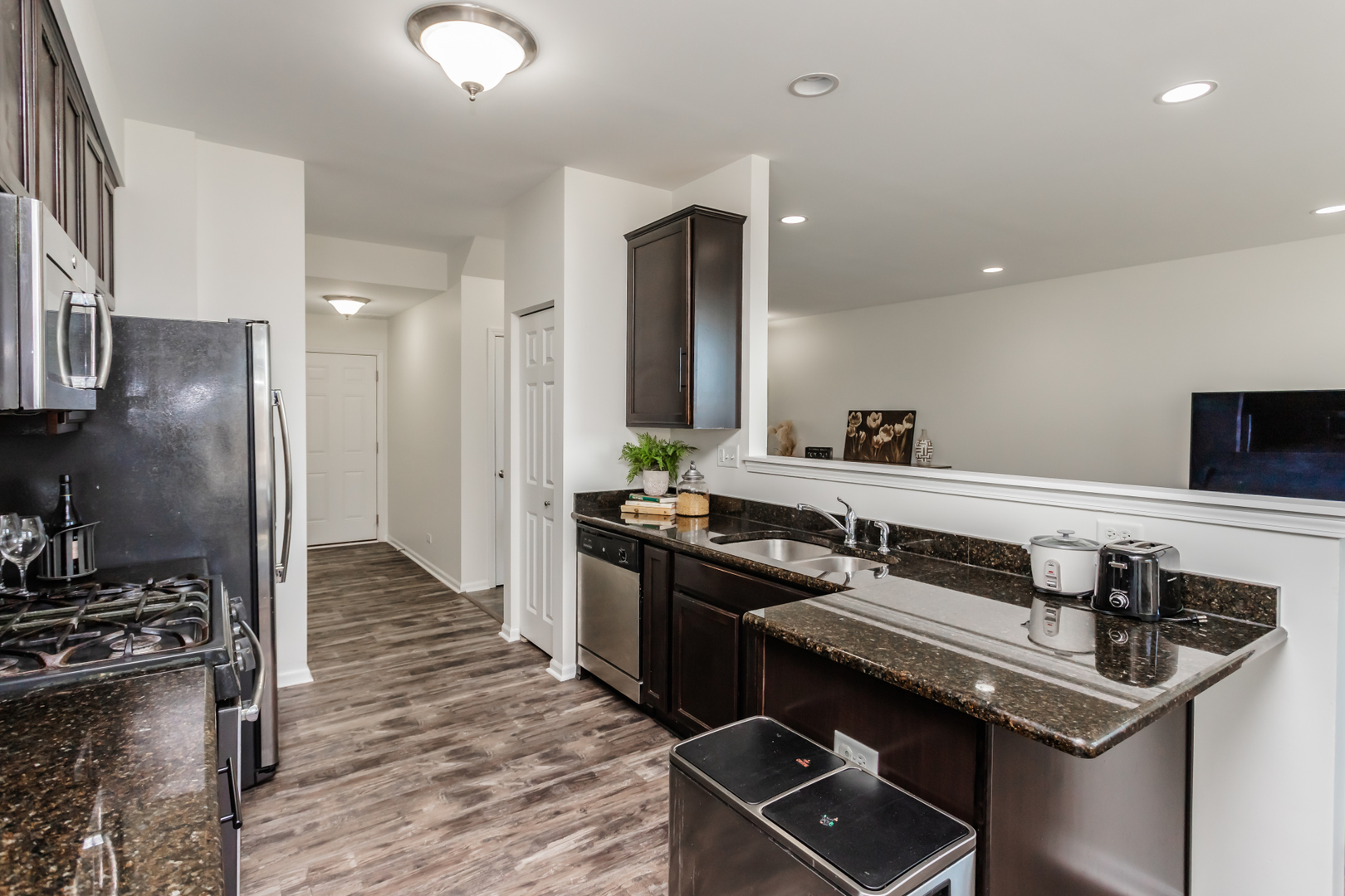2928 Church Road Aurora, IL 60502 - Photo 11 of 29 a kitchen that has a sink stainless steel appliances and cabinets