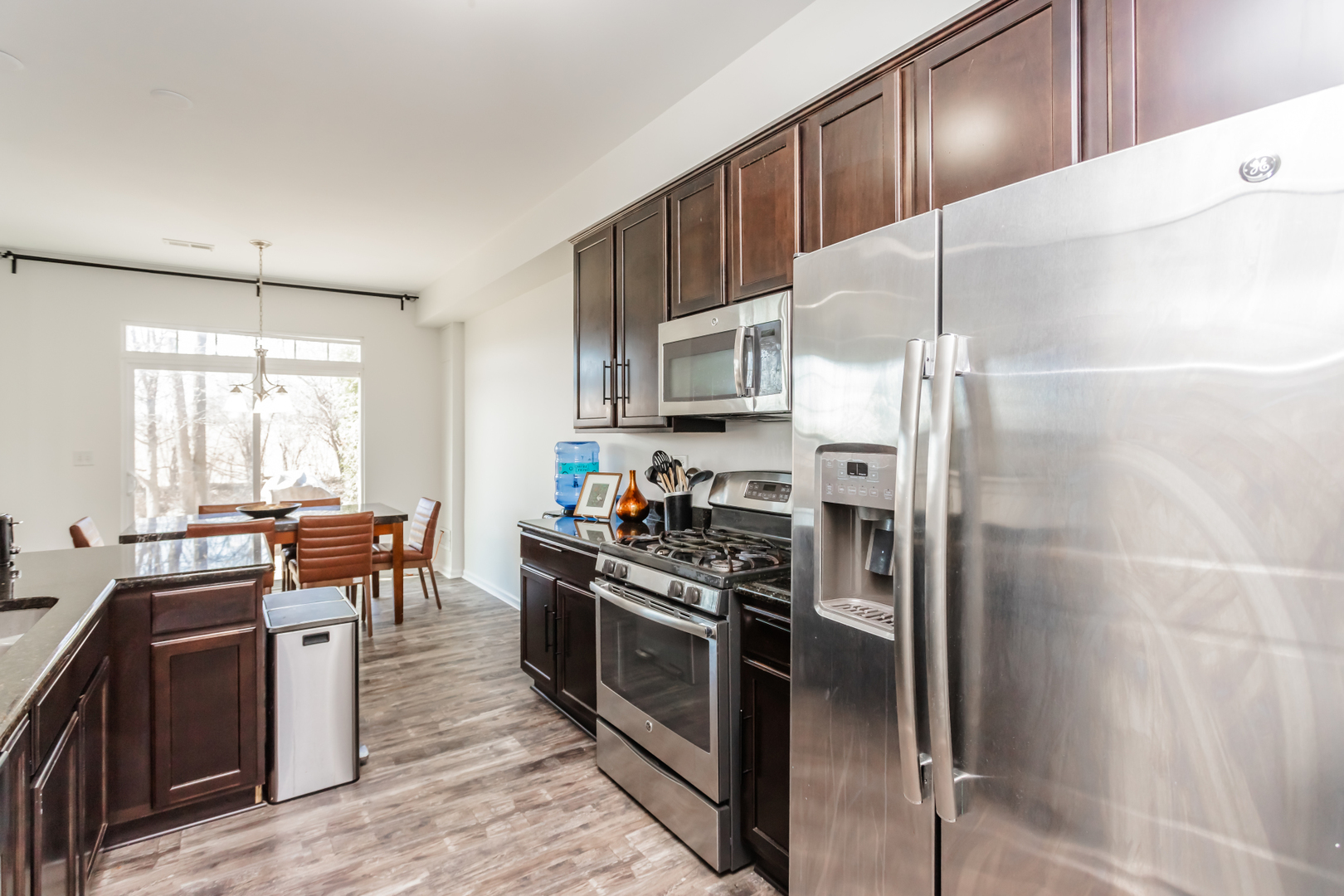 2928 Church Road Aurora, IL 60502 - Photo 13 of 29 a kitchen with stainless steel appliances kitchen island granite countertop a refrigerator a stove a sink and dishwasher