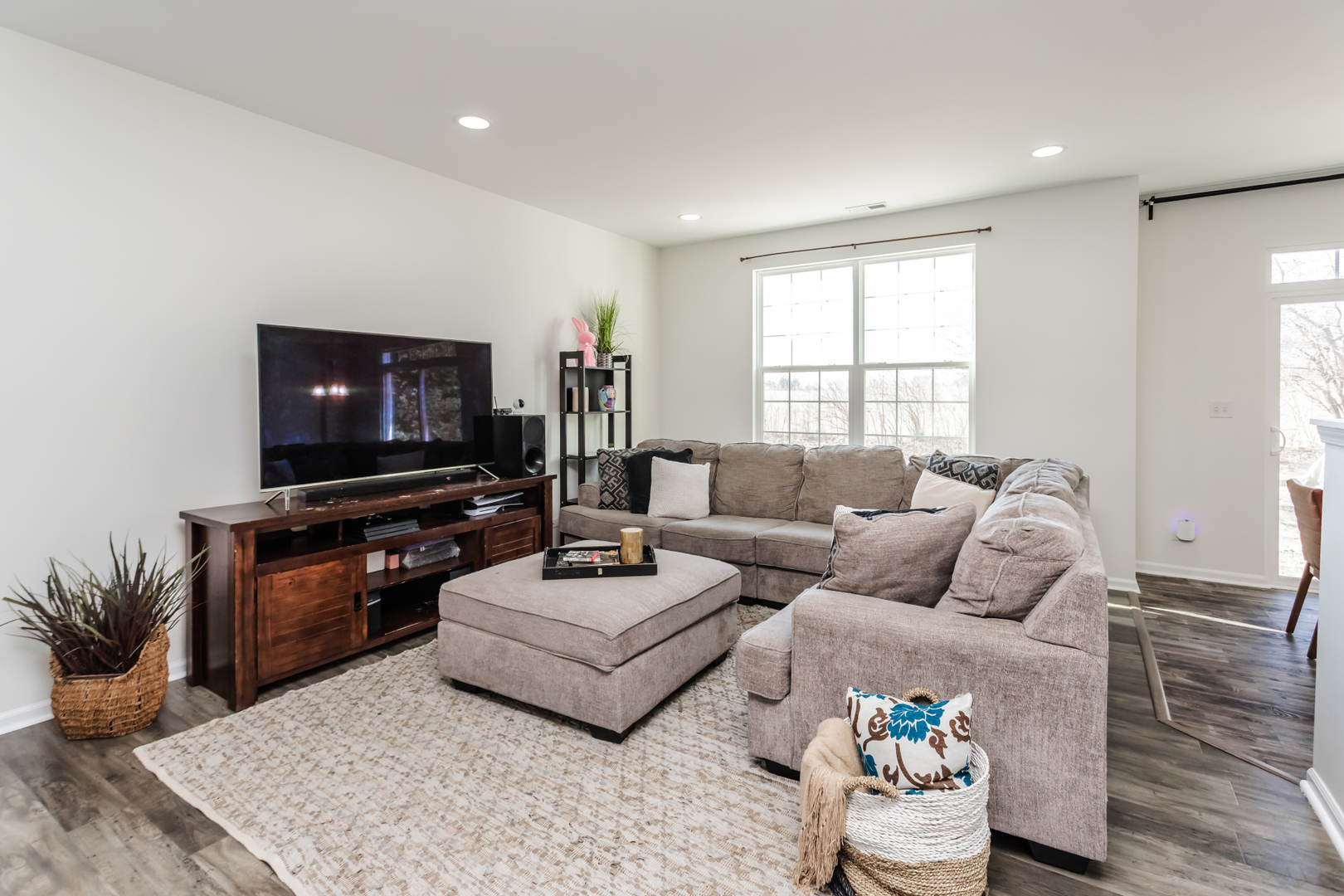 2928 Church Road Aurora, IL 60502 - Photo 6 of 29 a living room with furniture and a flat screen tv