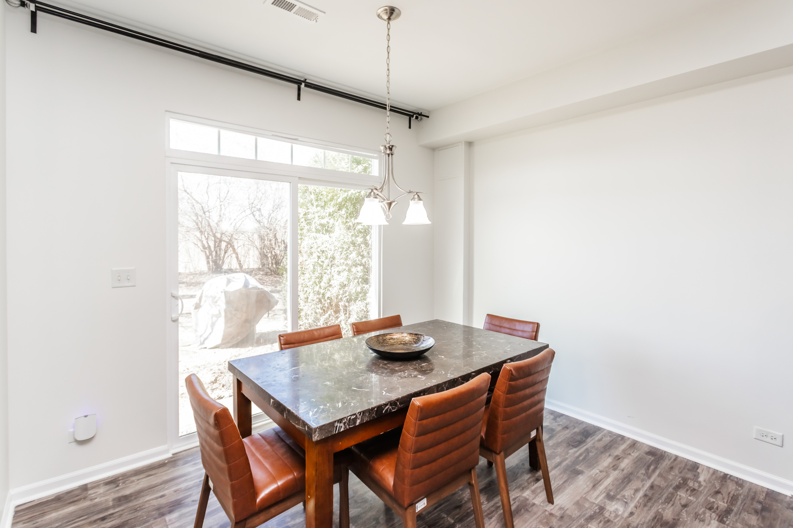2928 Church Road Aurora, IL 60502 - Photo 7 of 29 a view of a dining room with furniture window and wooden floor