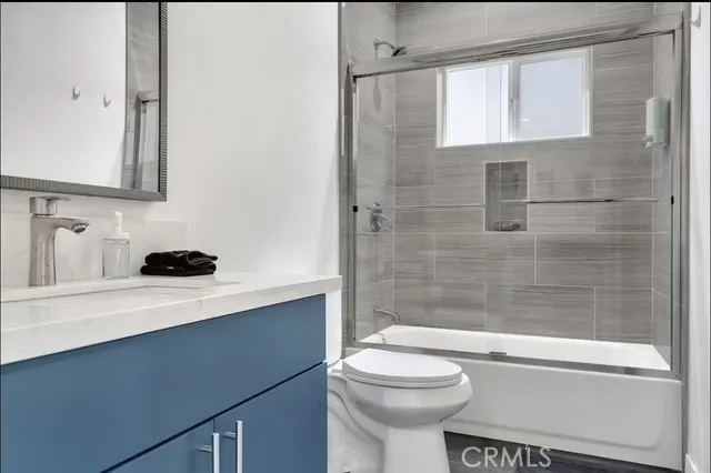 a bathroom with a shower and toilet