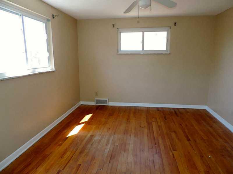 141 Techview Terrace Pittsburgh, PA 15213 - Photo 16 of 25 a view of a room with wooden floor and windows