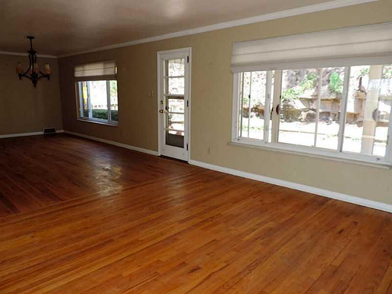 141 Techview Terrace Pittsburgh, PA 15213 - Photo 4 of 25 an empty room with wooden floor and windows