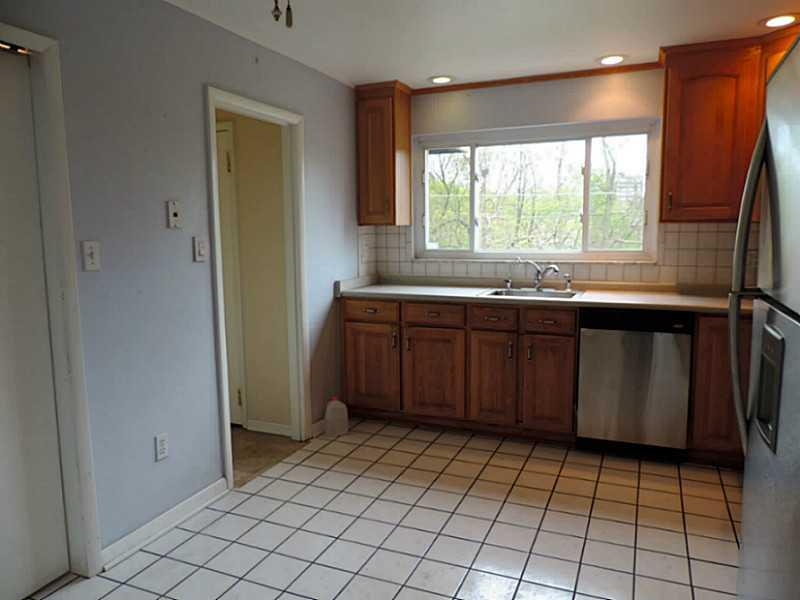 141 Techview Terrace Pittsburgh, PA 15213 - Photo 8 of 25 a kitchen with a sink a counter top space and cabinets