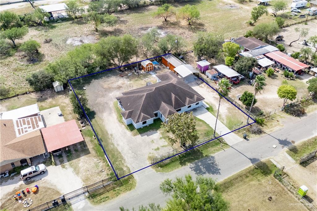 1608 Corales Street Mission, TX 78573 - Photo 2 of 29 an aerial view of a house with a yard and lake view