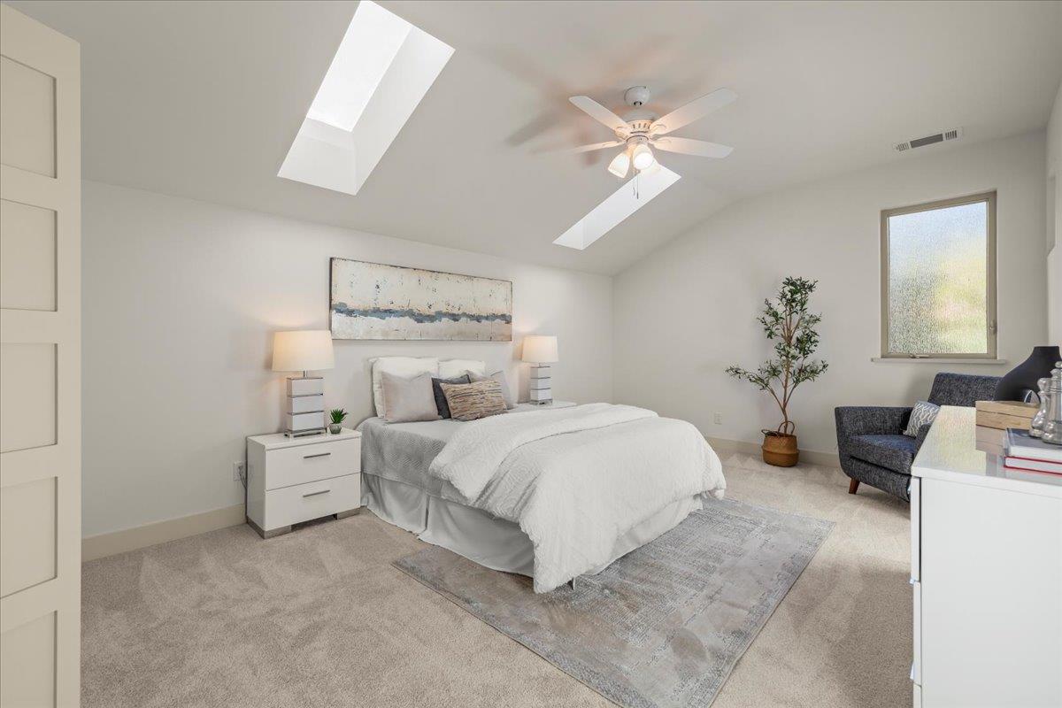 361 Collado Drive Scotts Valley, CA 95066 - Photo 23 of 37 a bedroom with bed and a chandelier