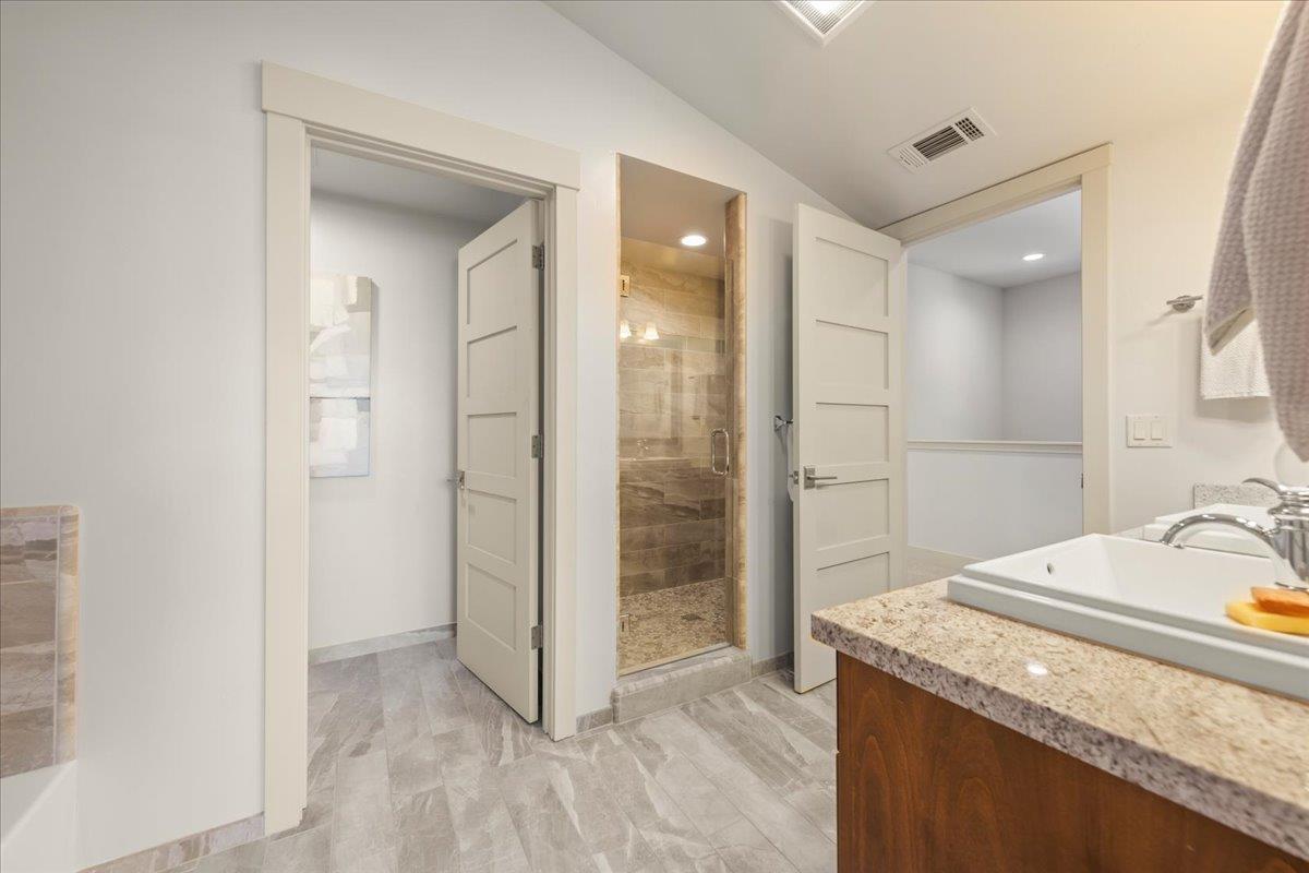 361 Collado Drive Scotts Valley, CA 95066 - Photo 31 of 37 a bathroom with a granite countertop sink a mirror and a shower
