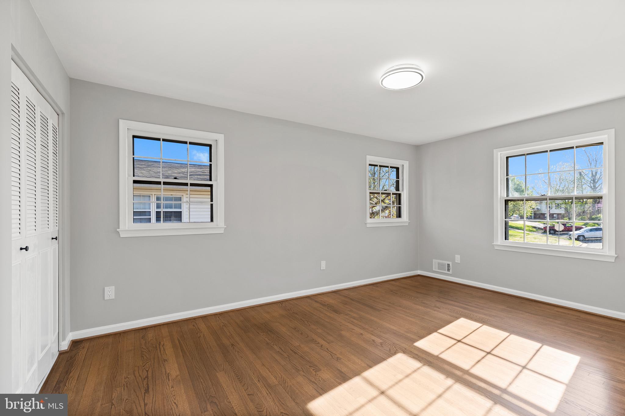 7517 Todd Place Manassas, VA 20109 - Photo 21 of 42 a view of an empty room with wooden floor and a window