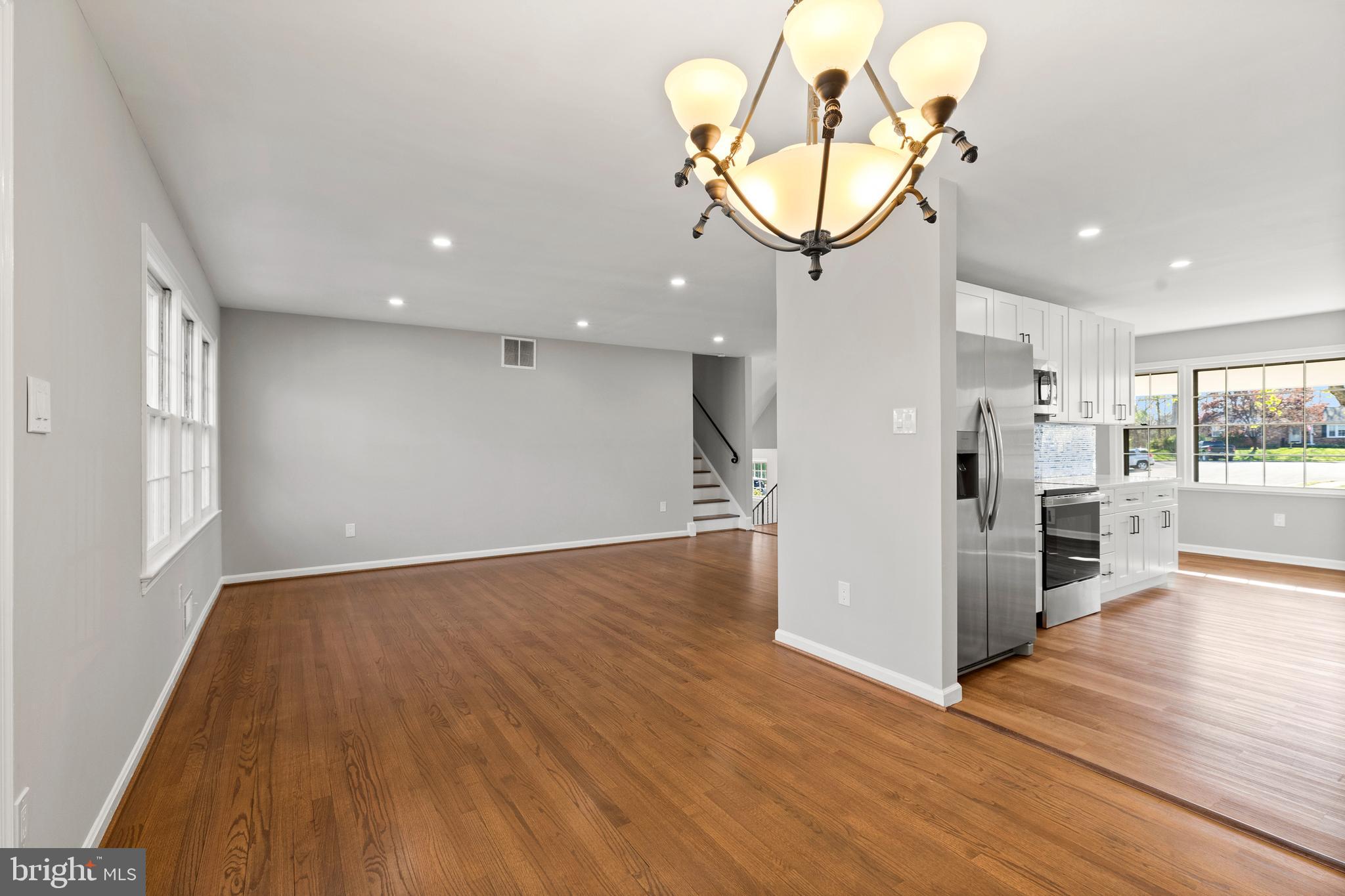 7517 Todd Place Manassas, VA 20109 - Photo 26 of 42 a view of a room with wooden floor and staircase