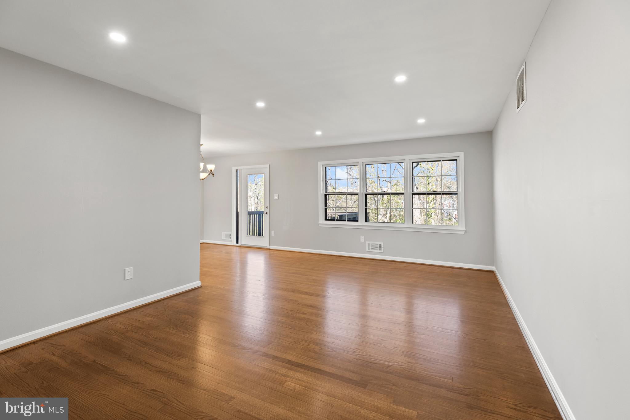 7517 Todd Place Manassas, VA 20109 - Photo 27 of 42 an empty room with wooden floor and windows