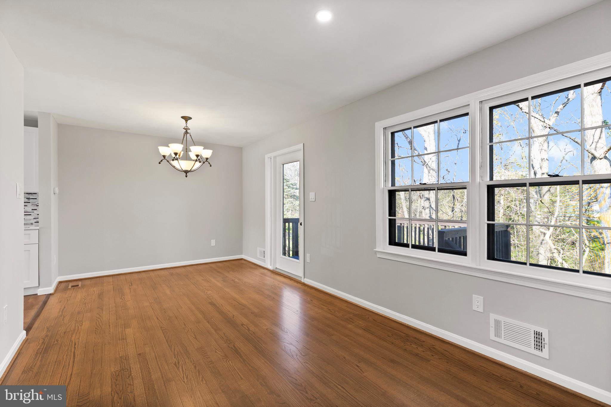 7517 Todd Place Manassas, VA 20109 - Photo 28 of 42 an empty room with wooden floor and windows