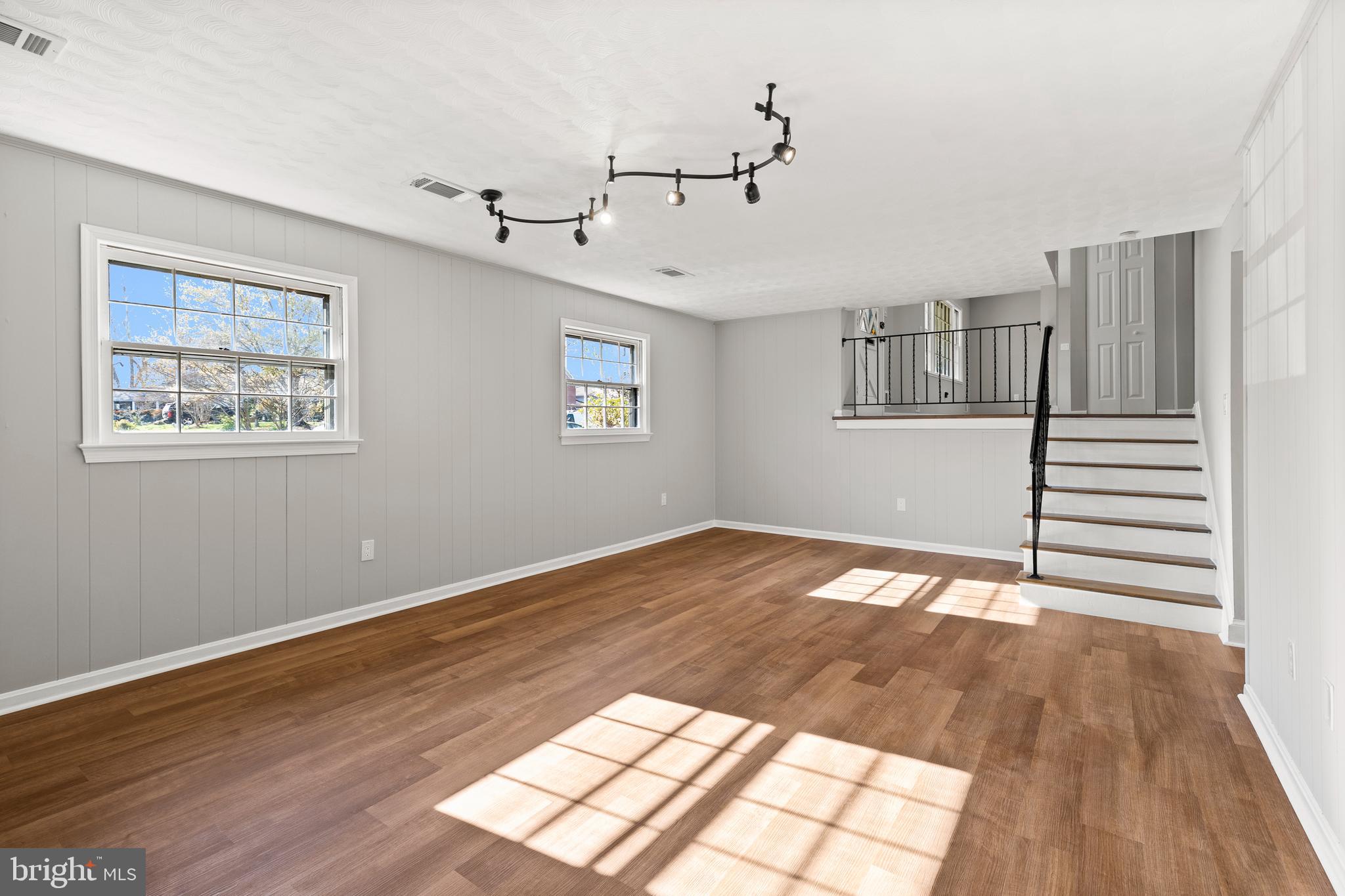 7517 Todd Place Manassas, VA 20109 - Photo 30 of 42 a view of an empty room with wooden floor and a window