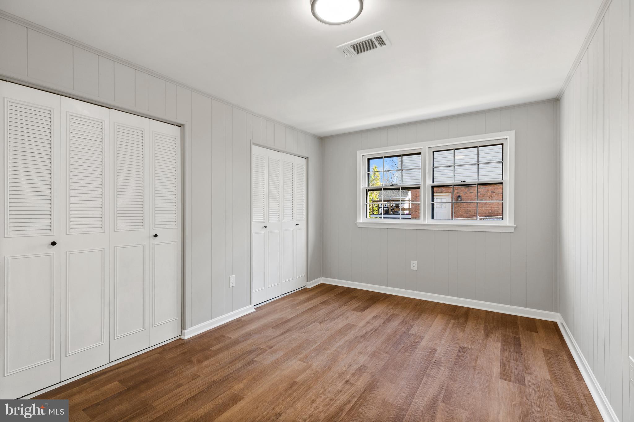 7517 Todd Place Manassas, VA 20109 - Photo 31 of 42 a view of an empty room with wooden floor and a window