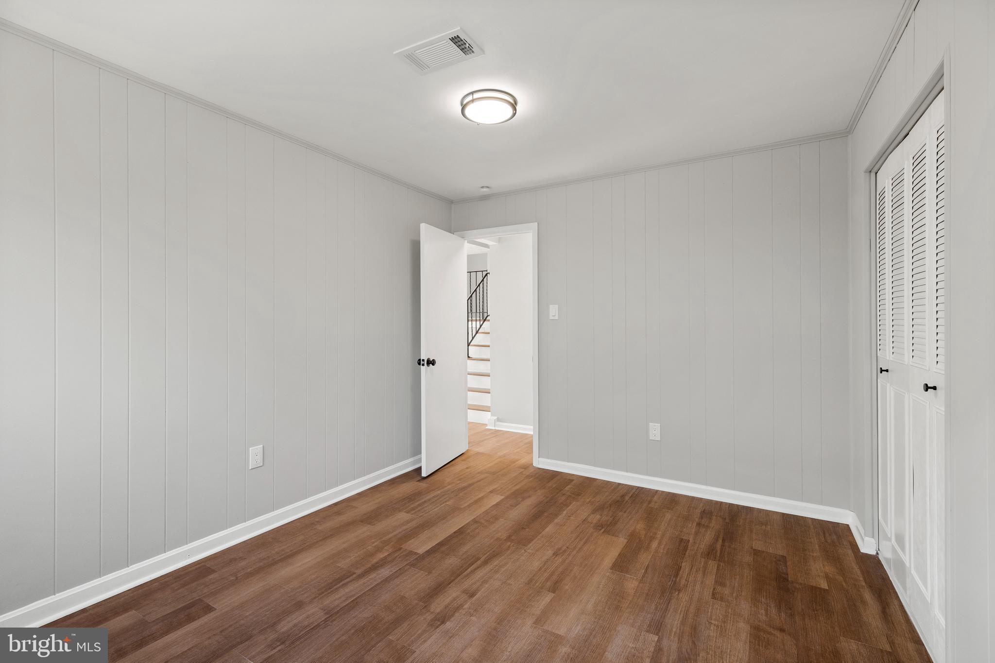 7517 Todd Place Manassas, VA 20109 - Photo 32 of 42 a view of an empty room with wooden floor