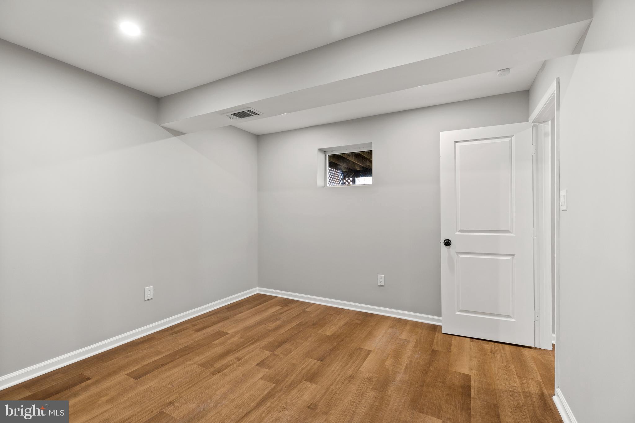 7517 Todd Place Manassas, VA 20109 - Photo 39 of 42 a view of an empty room with wooden floor