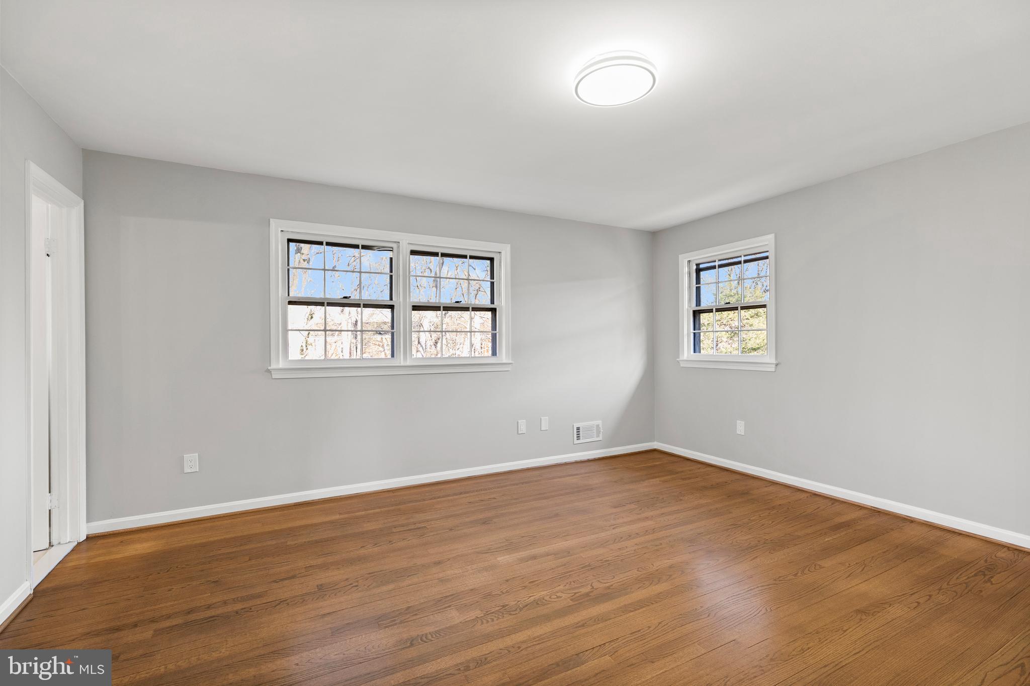 7517 Todd Place Manassas, VA 20109 - Photo 40 of 42 a view of empty room with wooden floor and fan