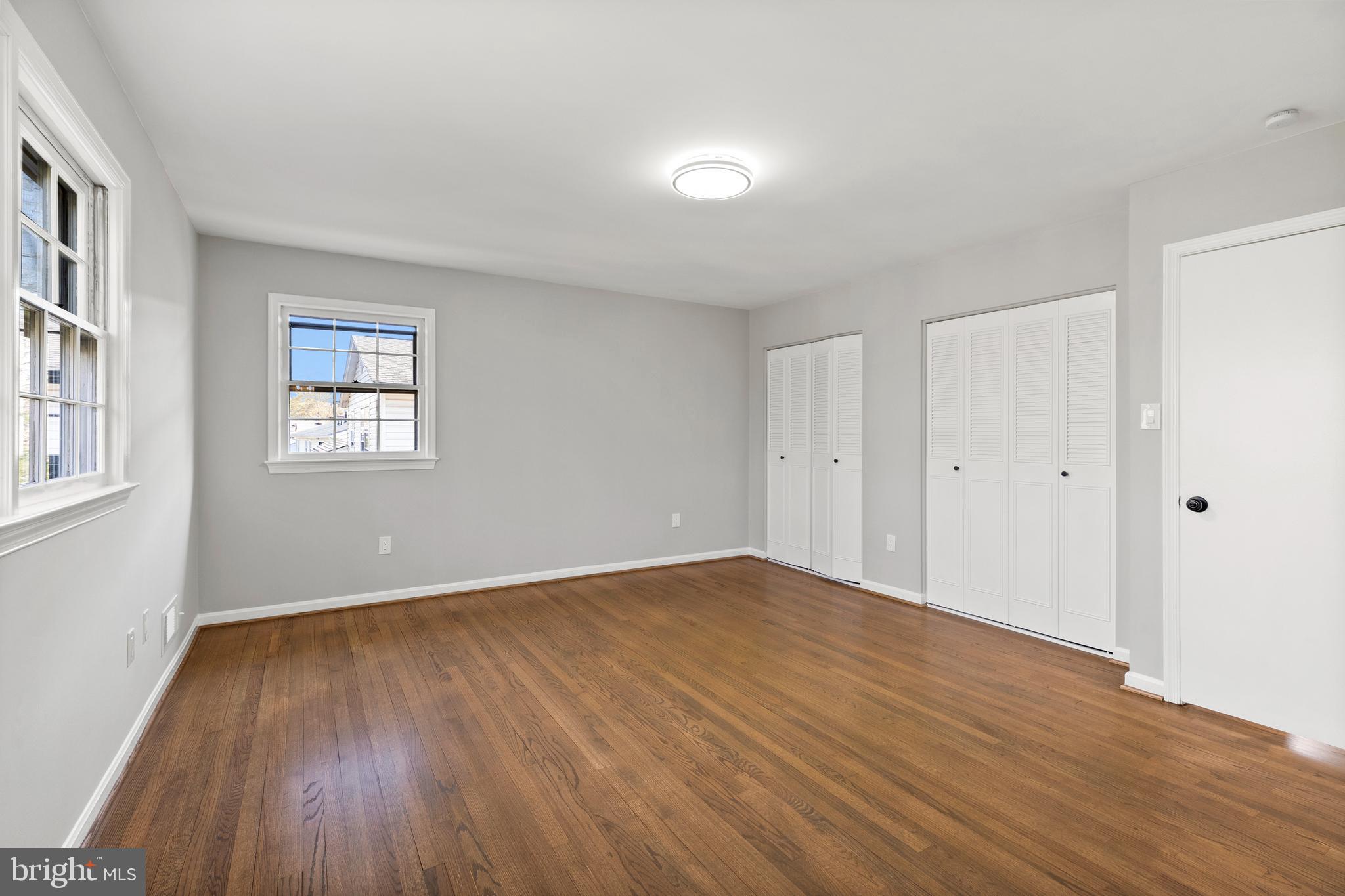 7517 Todd Place Manassas, VA 20109 - Photo 41 of 42 a view of an empty room with wooden floor and a window