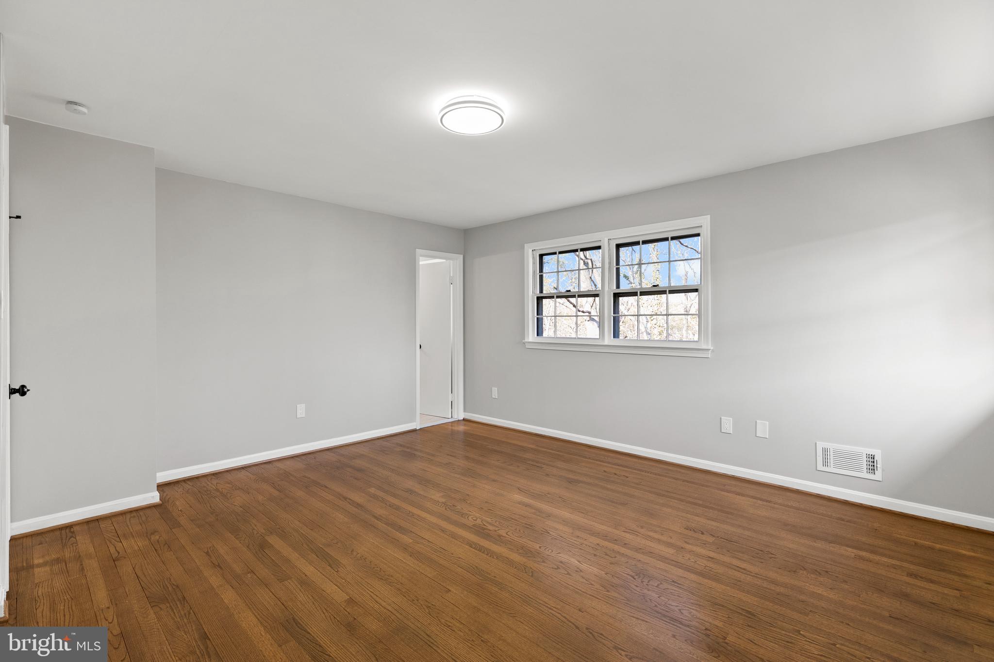 7517 Todd Place Manassas, VA 20109 - Photo 42 of 42 a view of empty room with wooden floor and fan