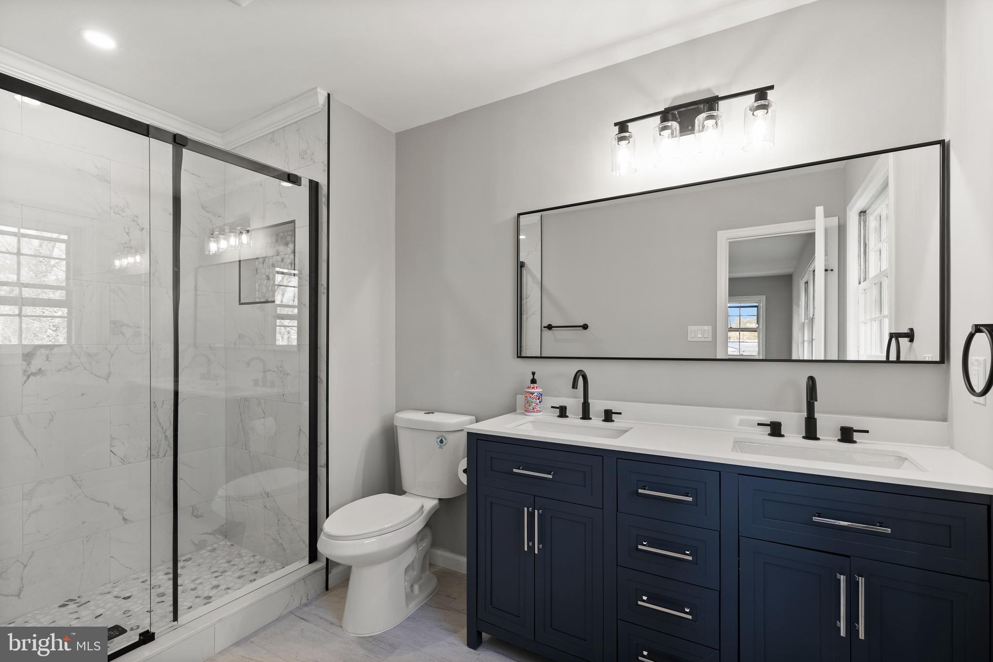 7517 Todd Place Manassas, VA 20109 - Photo 10 of 42 a bathroom with a toilet sink and shower