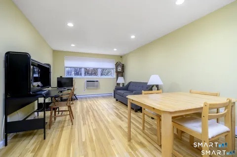 637 Cove Road, Unit A3 Stamford, CT 06902 - Photo 4 of 7 a living room with furniture and a flat screen tv