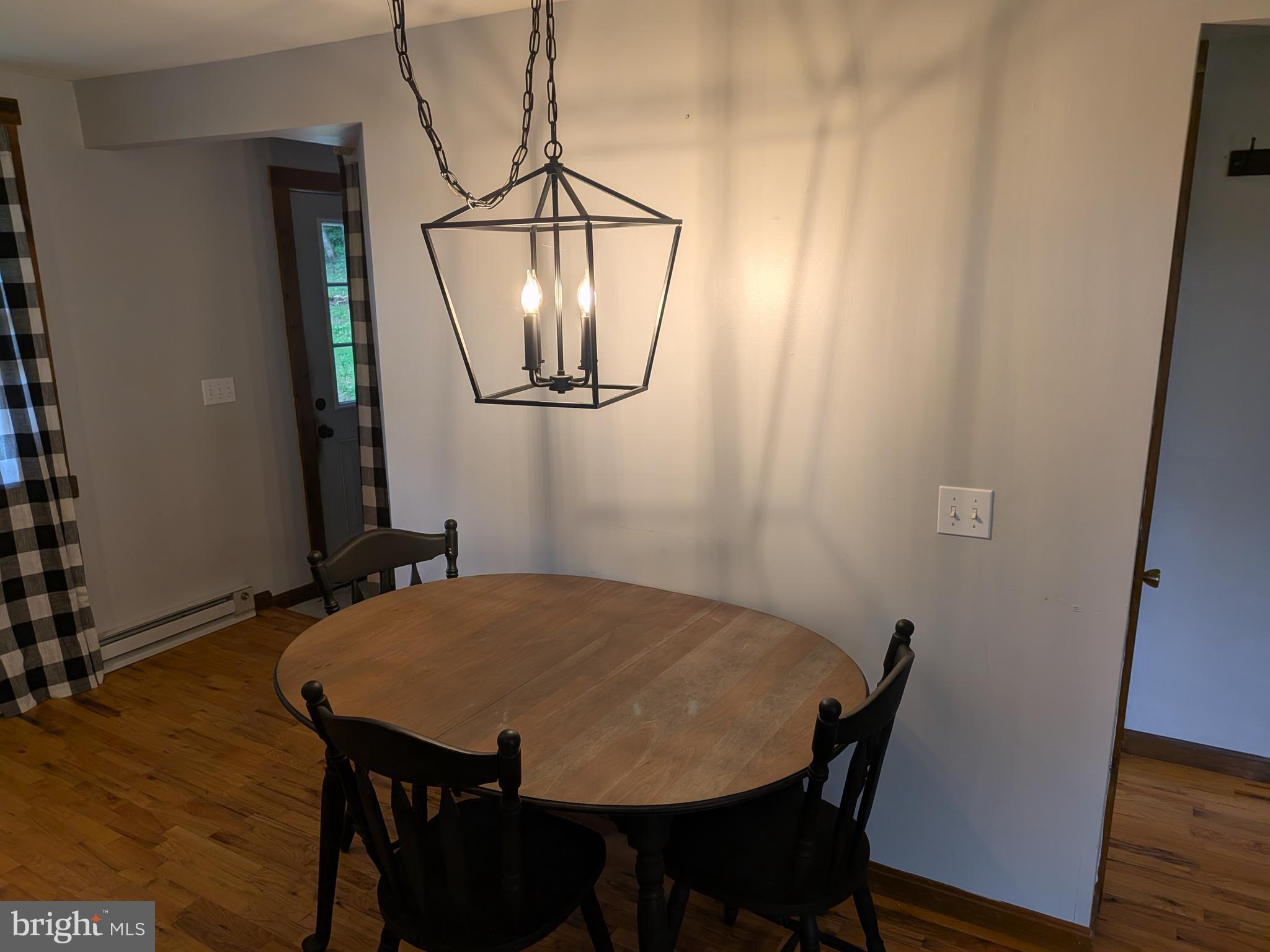 2418 Muddy Run Road Mifflintown, PA 17059 - Photo 21 of 44 a view of a dining room with furniture and wooden floor