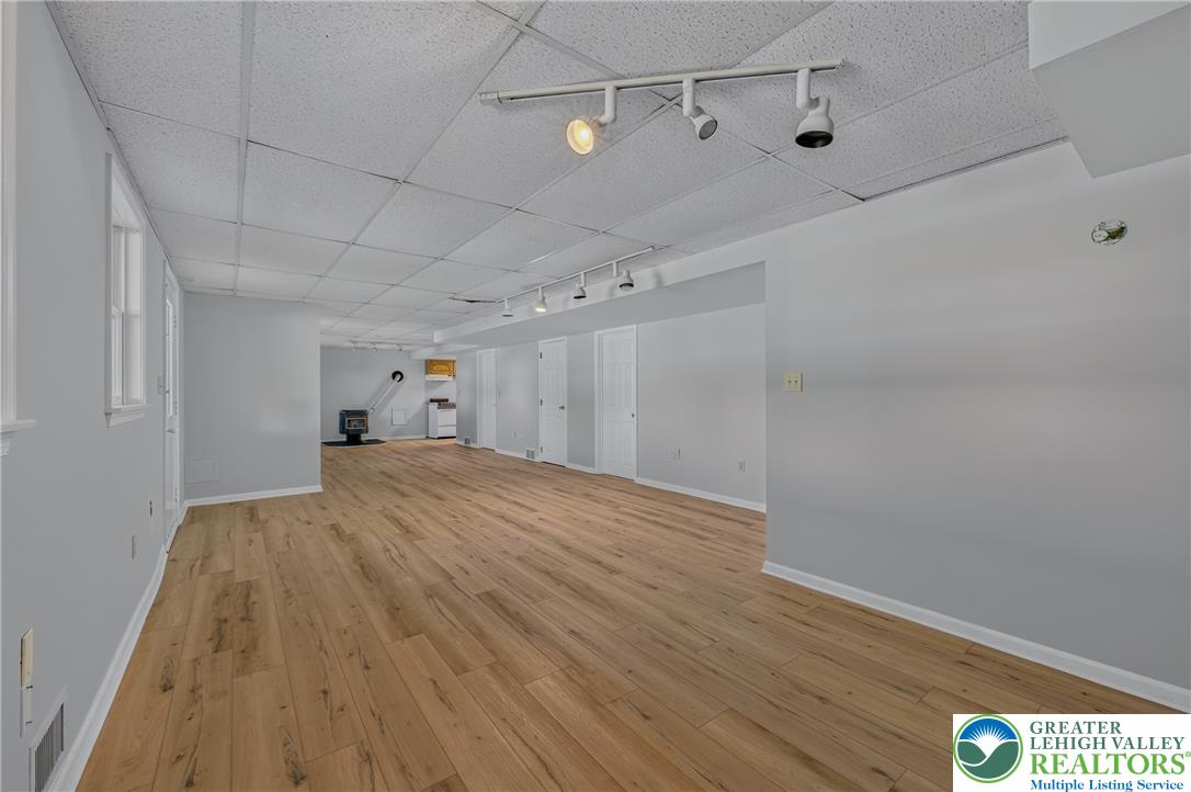 630 Clearfield Road Nazareth, PA 18064 - Photo 73 of 100 Smooth wood-plank flooring runs the length of this versatile, wide-open lower level space.