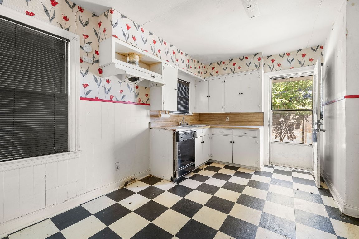 4419 Clawson Road Austin, TX 78704 - Photo 13 of 24 a kitchen with a checkered floor and a refrigerator