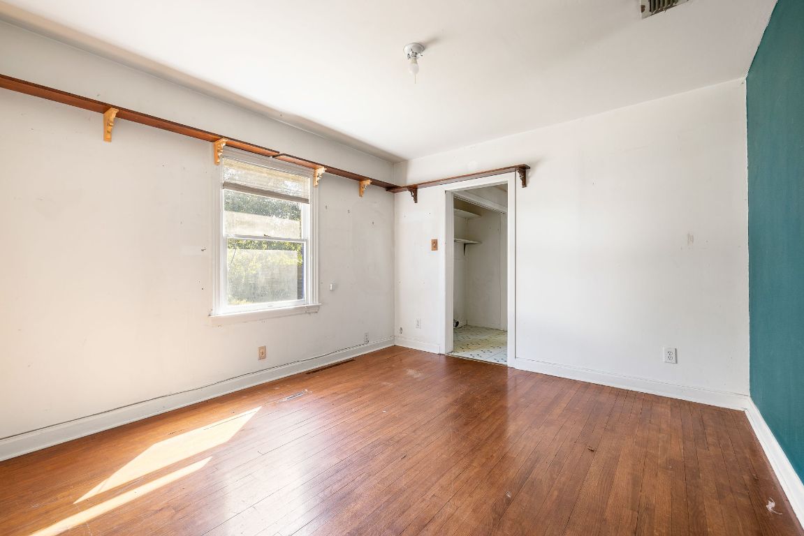 4419 Clawson Road Austin, TX 78704 - Photo 15 of 24 an empty room with wooden floor and windows