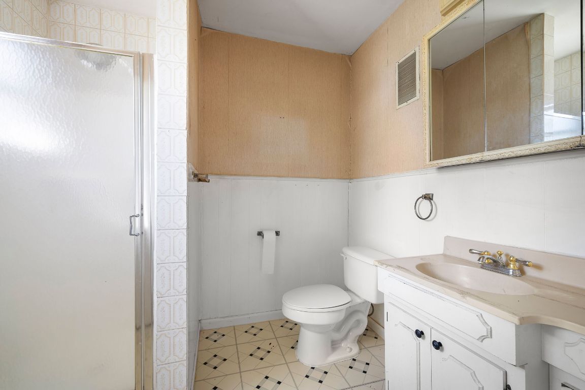4419 Clawson Road Austin, TX 78704 - Photo 17 of 24 a bathroom with a granite countertop sink toilet and shower