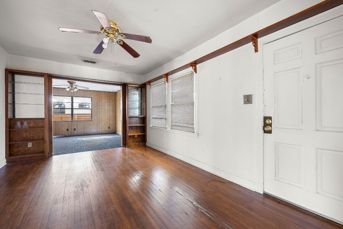 4419 Clawson Road Austin, TX 78704 - Photo 10 of 24 a view of an empty room with a window and wooden floor