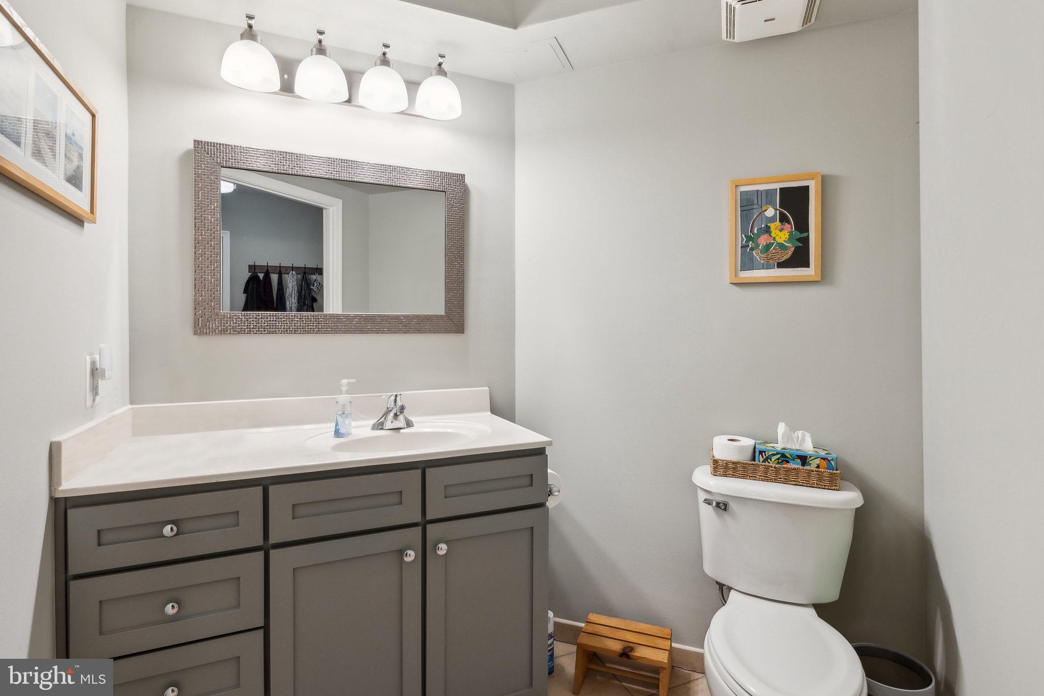 616 E Street Northwest, Unit 213 Washington, DC 20004 - Photo 14 of 80 Large 1/2 Bath with Neutral Tones in Entryway