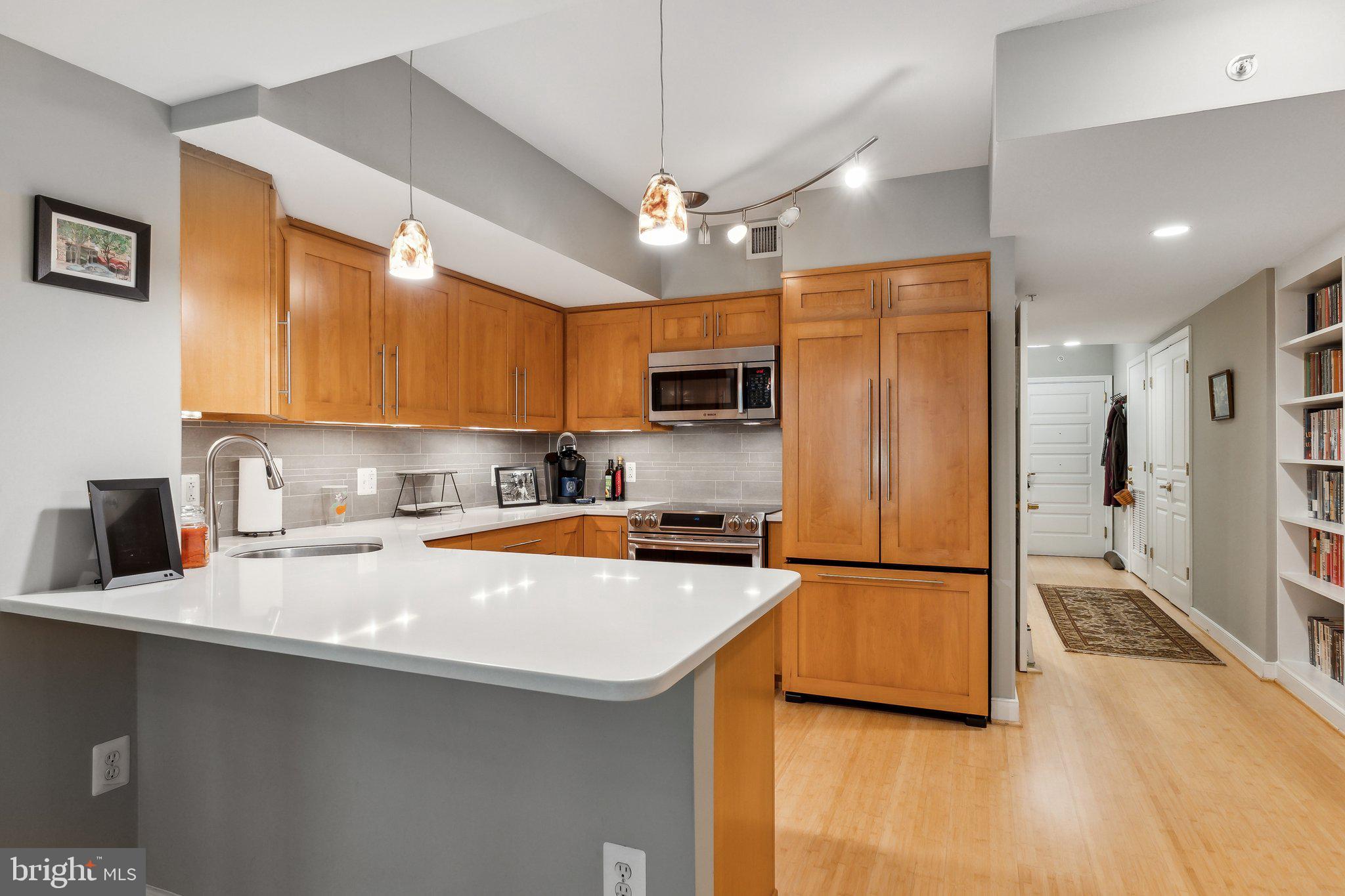616 E Street Northwest, Unit 213 Washington, DC 20004 - Photo 4 of 80 Light Paint and Wood Flooring throughout Condo