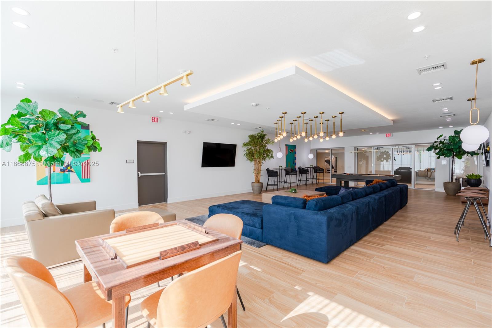 1950 West 49th Street, Unit 445 Hialeah, FL 33012 - Photo 27 of 39 a living room with furniture and a chandelier