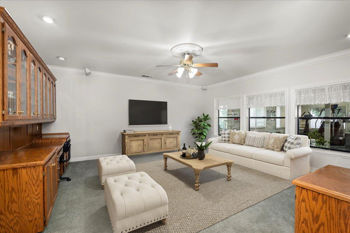 4616 Freelove Road Oakdale, CA 95361 - Photo 13 of 86 a living room with furniture and a flat screen tv