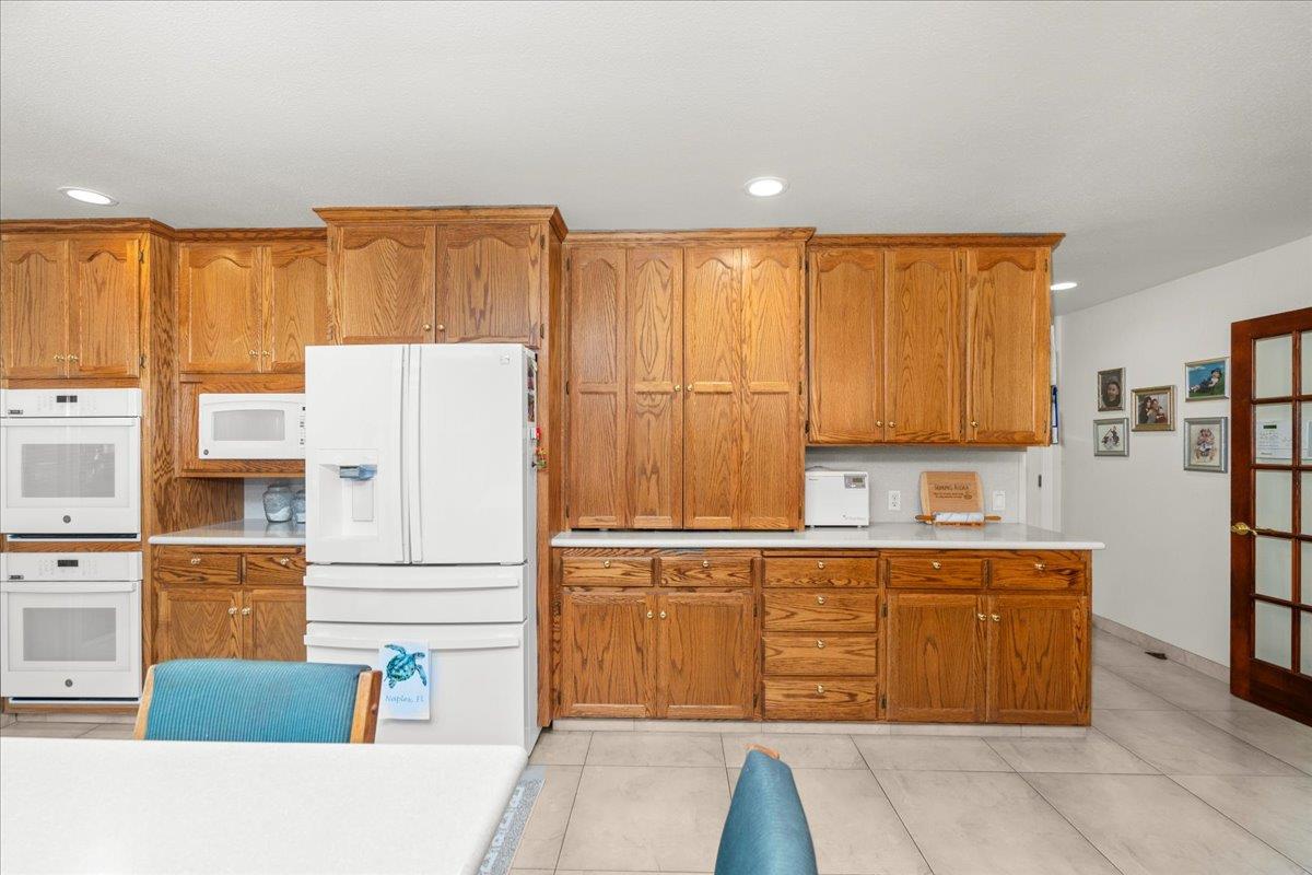 4616 Freelove Road Oakdale, CA 95361 - Photo 19 of 86 a kitchen with stainless steel appliances granite countertop a refrigerator and a stove top oven