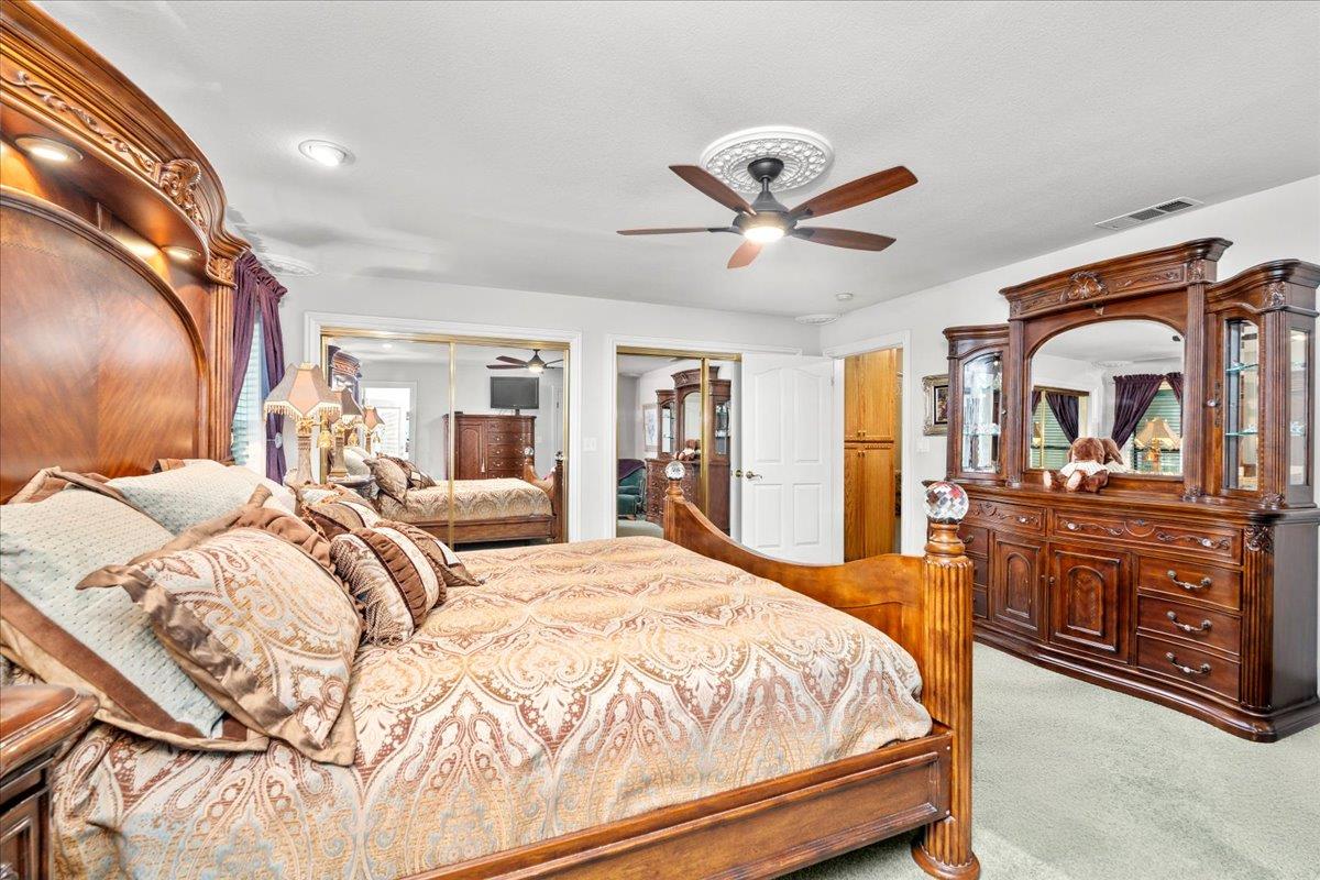 4616 Freelove Road Oakdale, CA 95361 - Photo 29 of 86 a bedroom with a bed and a large mirror on the dresser