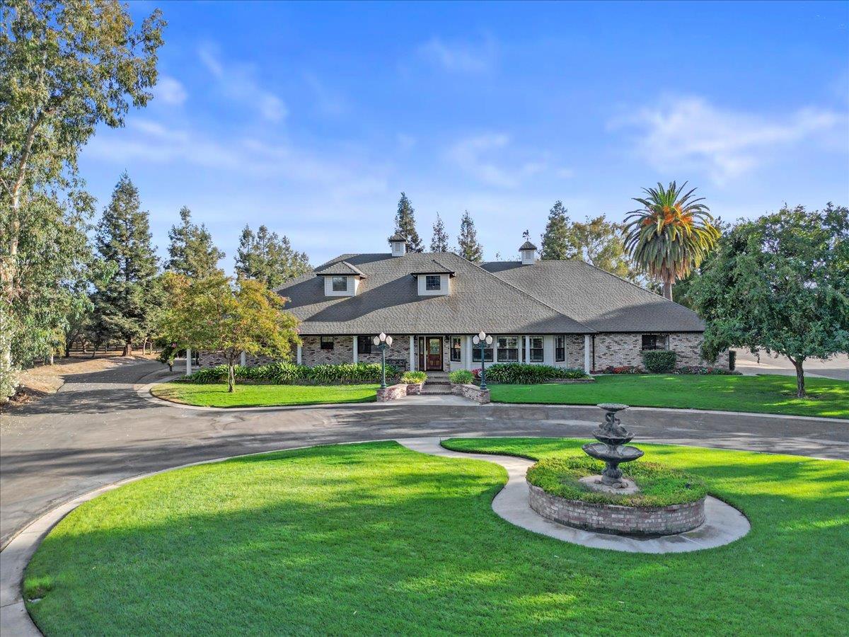 4616 Freelove Road Oakdale, CA 95361 - Photo 4 of 86 a front view of a house with a yard table and chairs