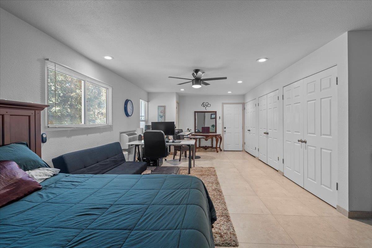 4616 Freelove Road Oakdale, CA 95361 - Photo 47 of 86 a bed room with a bed furniture and a window