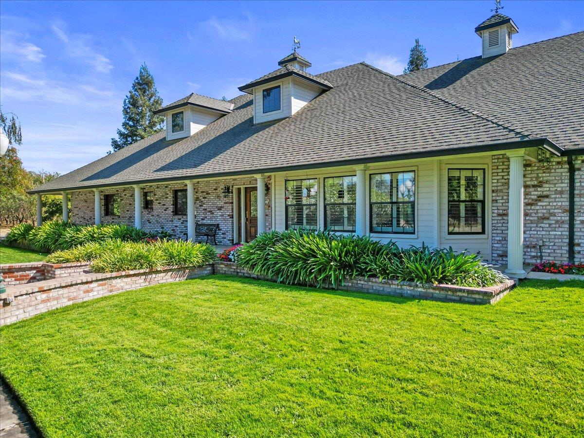 4616 Freelove Road Oakdale, CA 95361 - Photo 6 of 86 a front view of a house with a yard