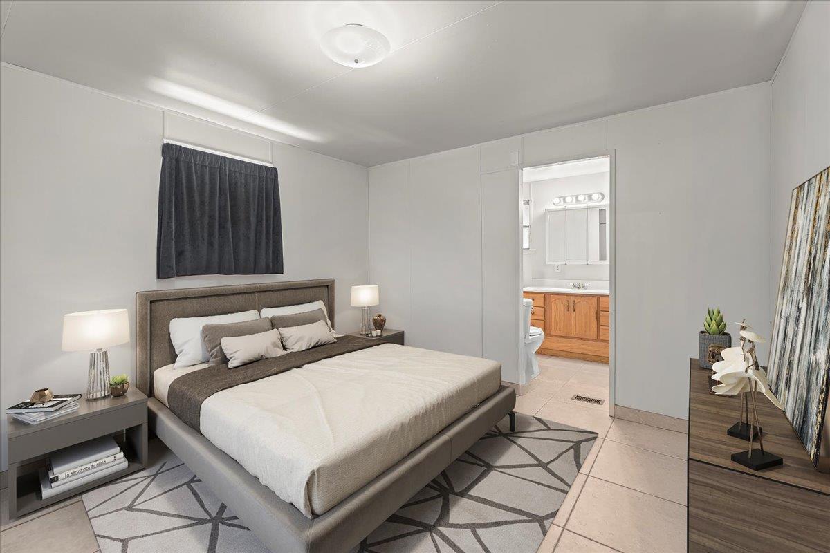 4616 Freelove Road Oakdale, CA 95361 - Photo 69 of 86 a bedroom with a bed and a potted plant