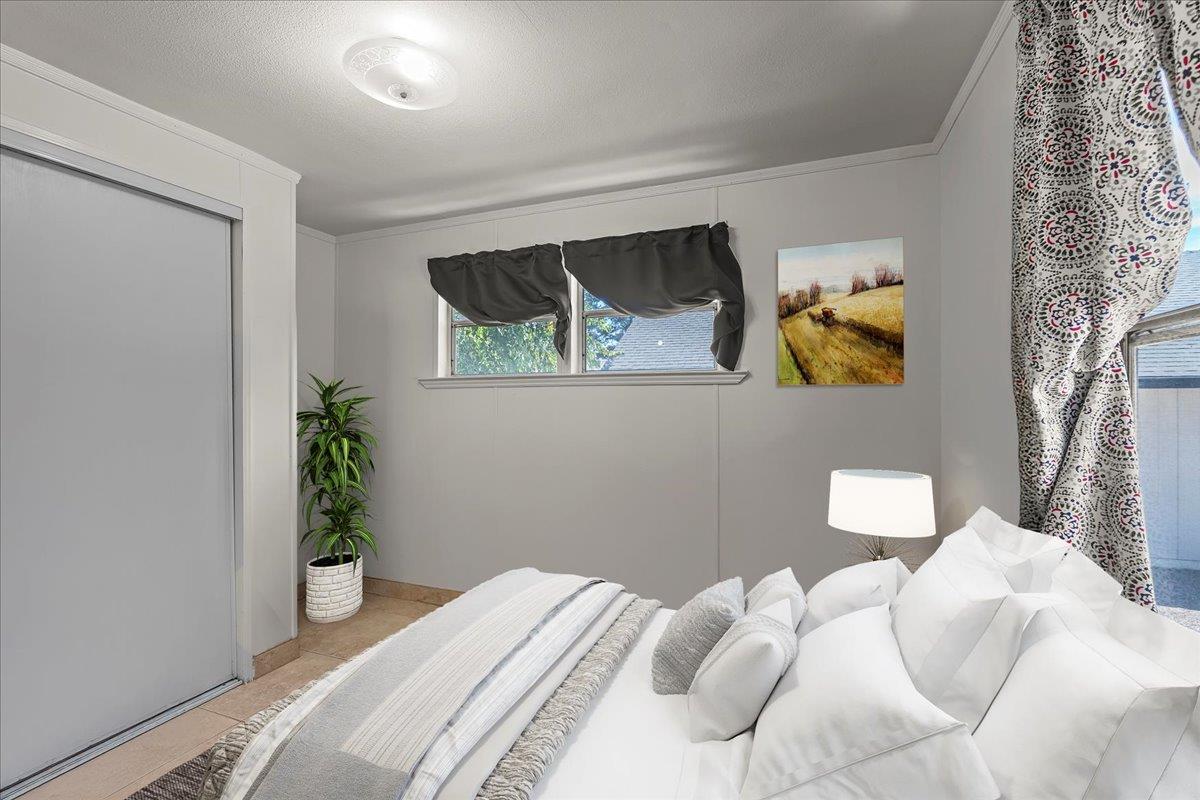 4616 Freelove Road Oakdale, CA 95361 - Photo 71 of 86 a bedroom with a bed and a plant