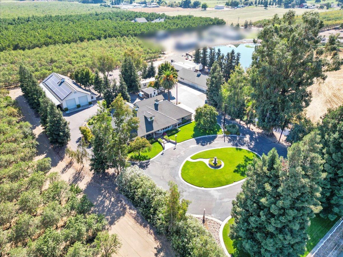 4616 Freelove Road Oakdale, CA 95361 - Photo 73 of 86 an aerial view of a house with a swimming pool outdoor seating and yard