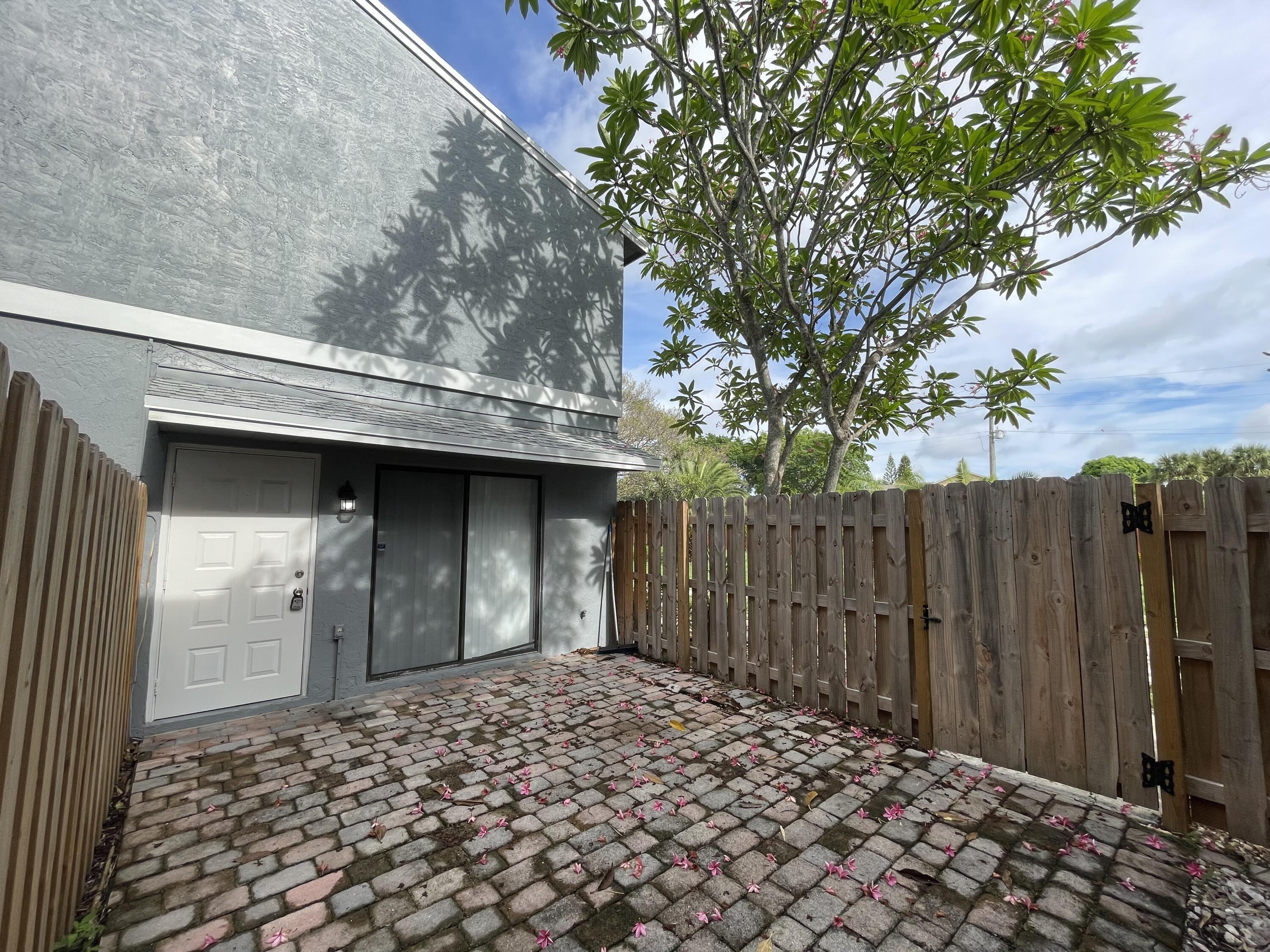 3 Crossings Circle, Unit A Boynton Beach, FL 33435 - Photo 2 of 21 a view of a wooden door