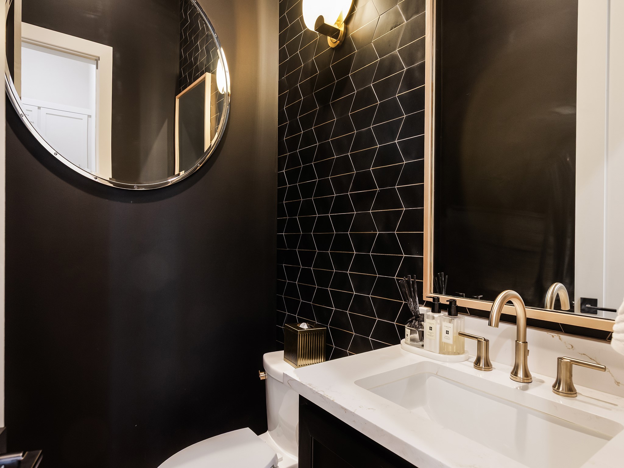 4024 Chatham Lane Houston, TX 77027 - Photo 22 of 50 a bathroom with a sink and a mirror