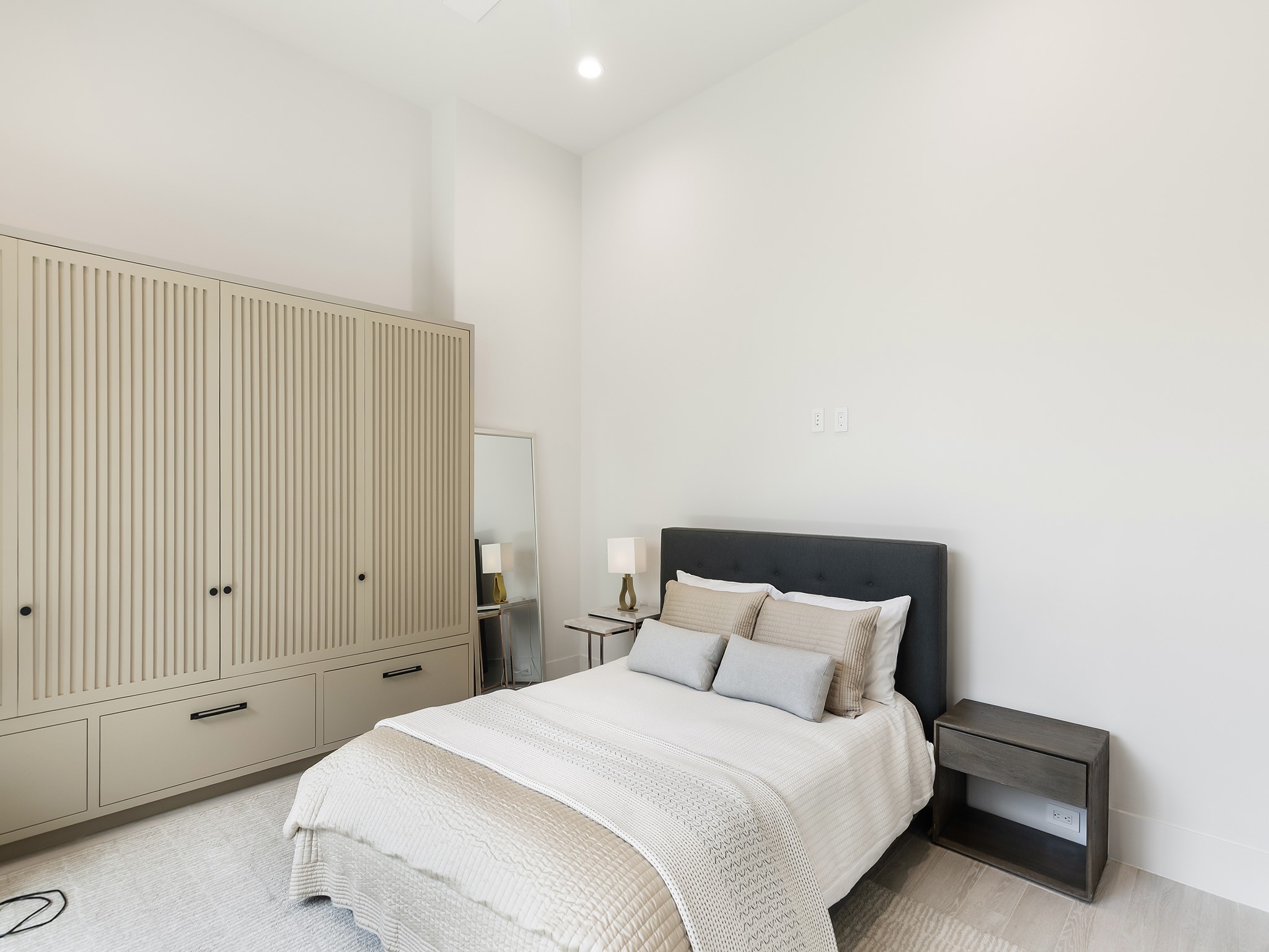 4024 Chatham Lane Houston, TX 77027 - Photo 23 of 50 a bedroom with a bed and a night stand