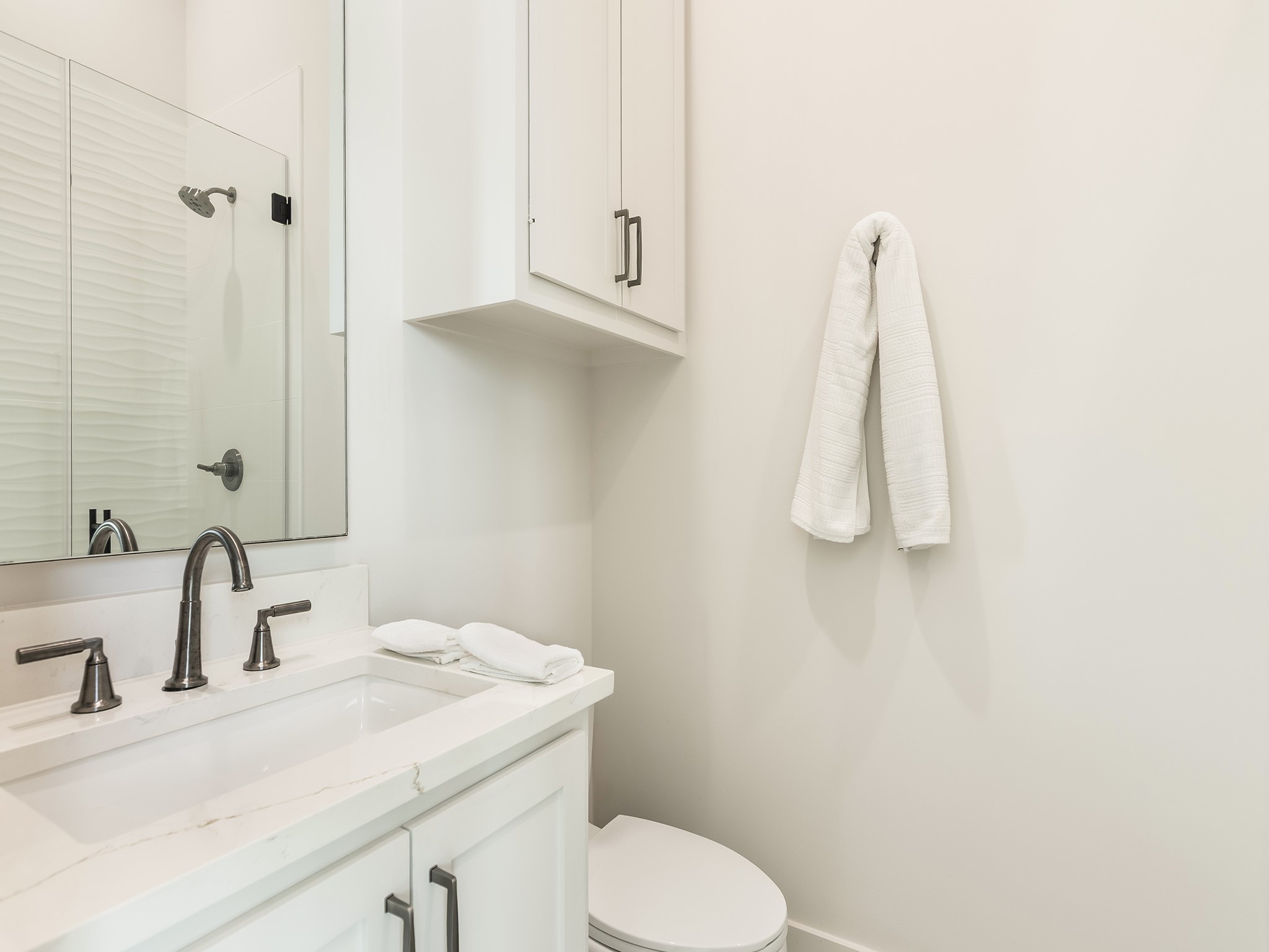 4024 Chatham Lane Houston, TX 77027 - Photo 25 of 50 a bathroom with a sink and a toilet
