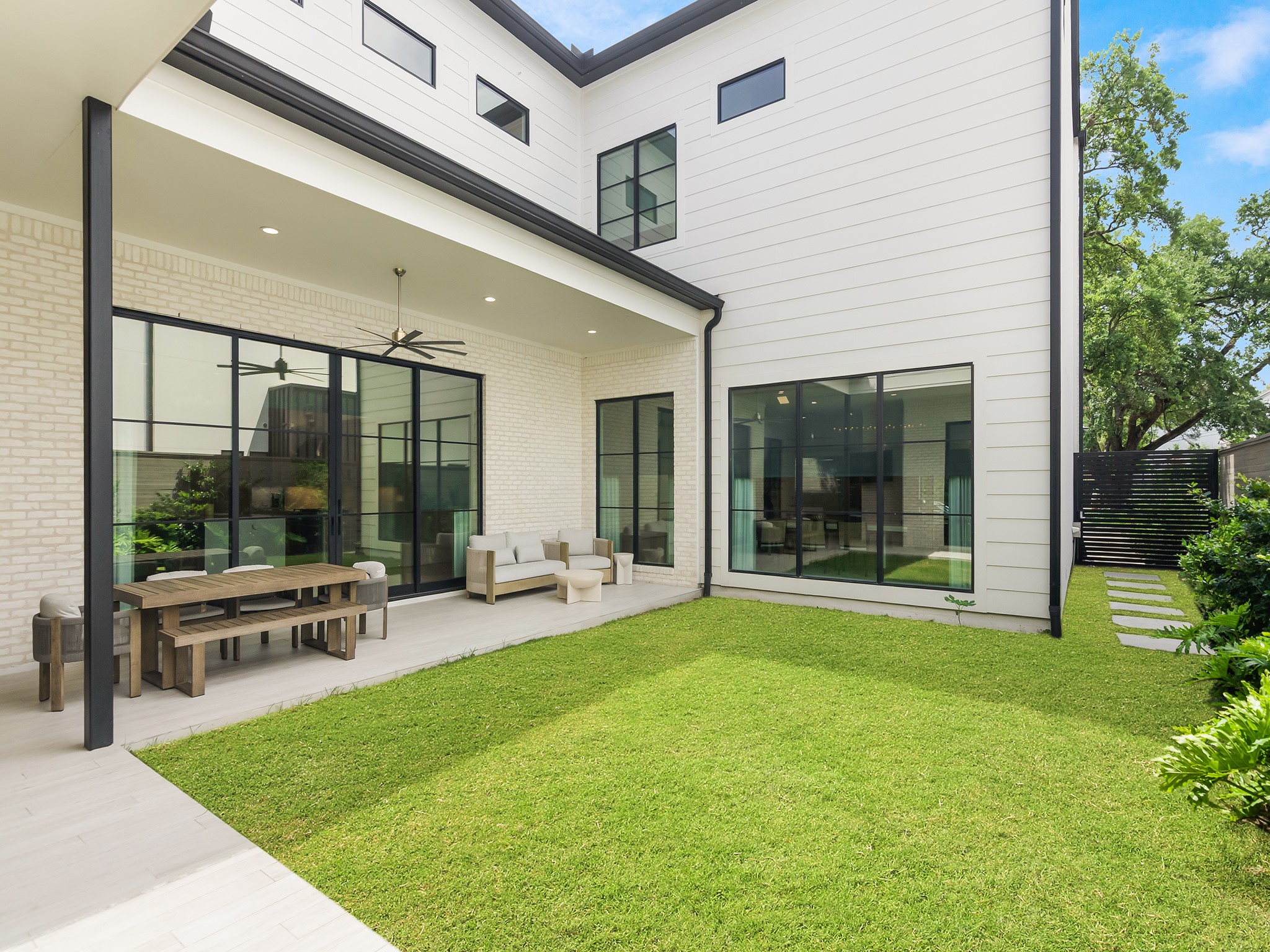 4024 Chatham Lane Houston, TX 77027 - Photo 28 of 50 a swimming pool with outdoor seating and a garden