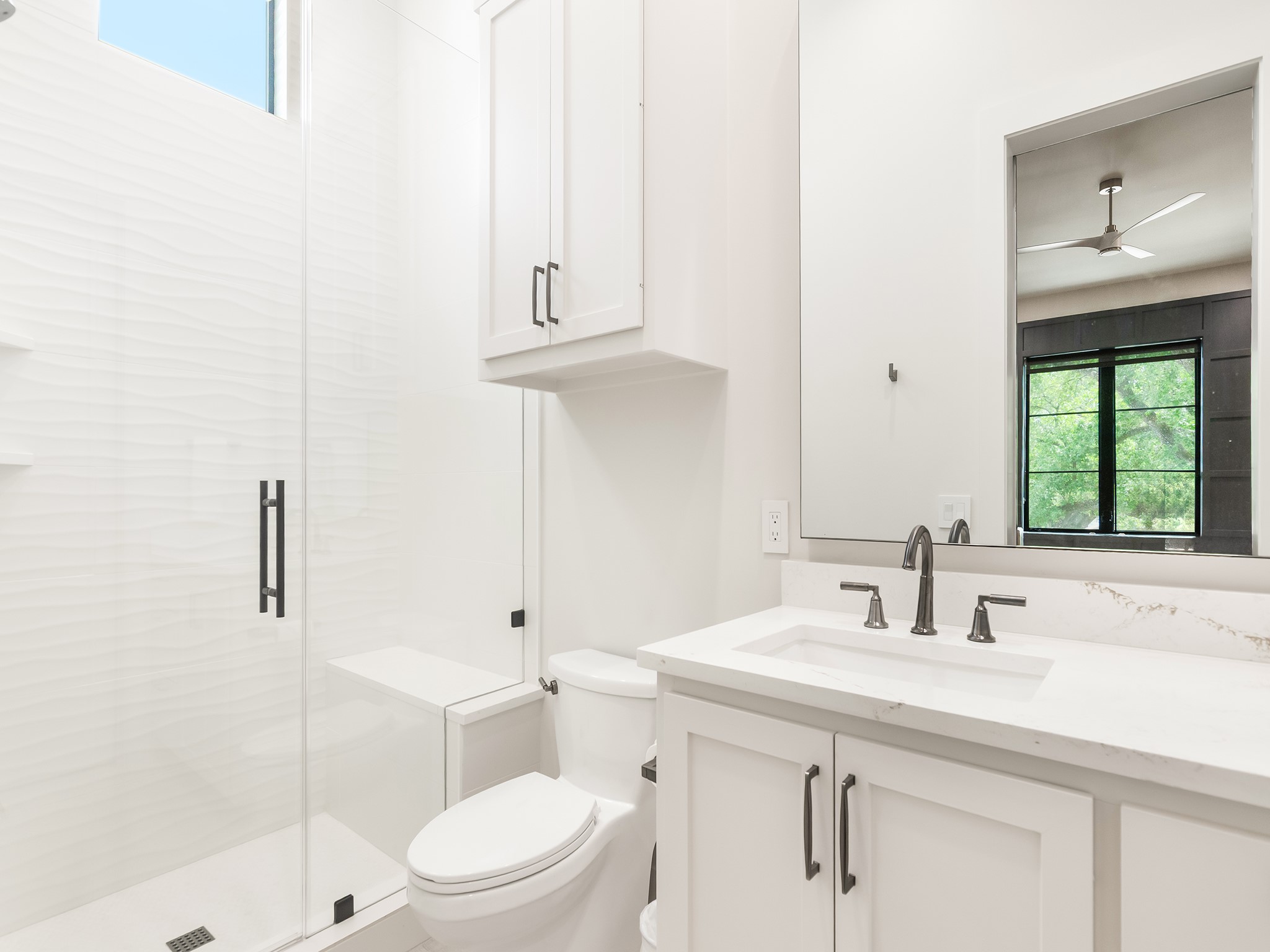 4024 Chatham Lane Houston, TX 77027 - Photo 33 of 50 a bathroom with a sink a toilet and shower