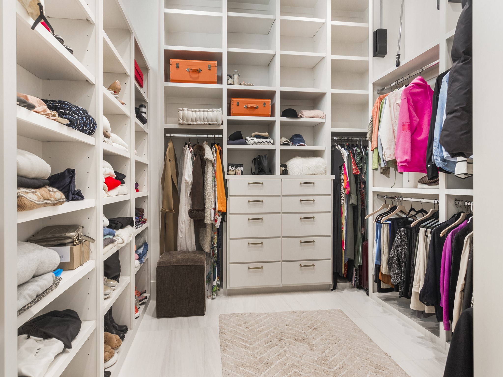 4024 Chatham Lane Houston, TX 77027 - Photo 42 of 50 a view of walk in closet with clothes and shoes